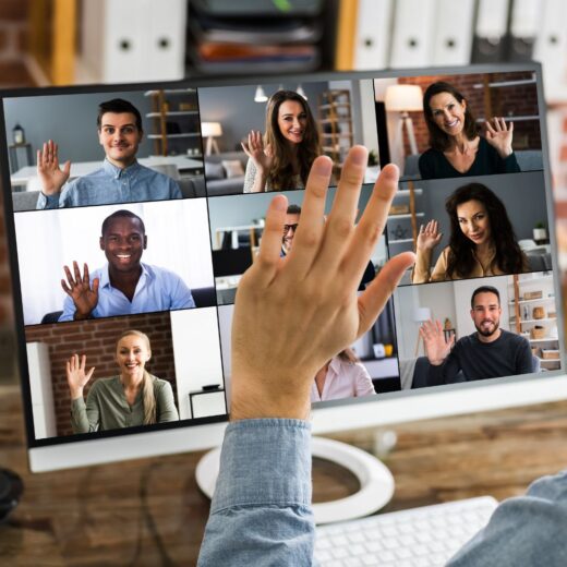 People waving during a video conference call